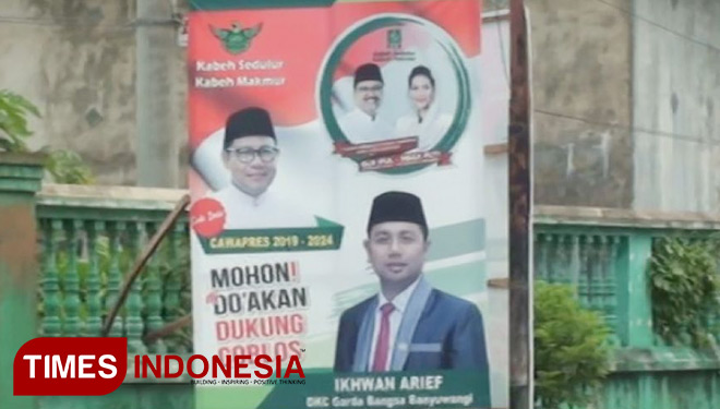 Salah satu baliho paslon Cagub-Cawagub Jatim 2018 yang ditumpangi gambar calon legislatif (FOTO: Hafil Ahmad/ TIMES Indonesia)