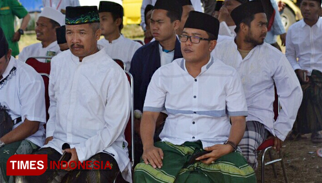 Ketua Cabang GP Ansor Kabupaten Malang, Husnul Hakim Syadad (kacamata), saat hadiri acara peringatan Hari Santri Nasional 2018. (FOTO: Imad/TIMES Indonesia)