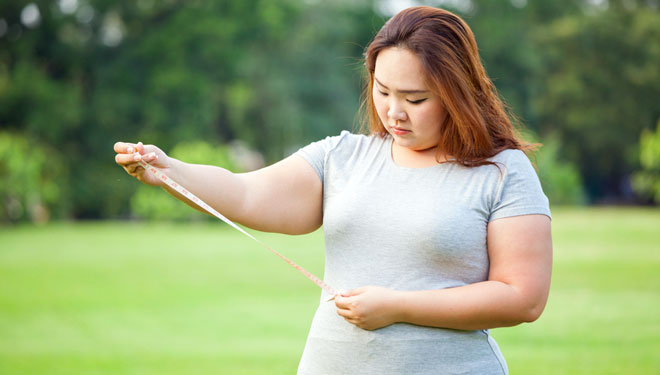 Ilustrasi - perempuan menderita obesitas cenderung depresi (Foto: WitthayaP /Shutterstock)