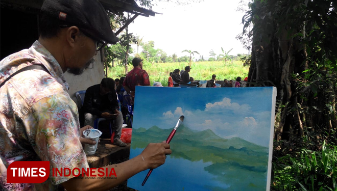 Para seniman saat mengekspresikan Kreatifitasnya di atas kanvas, melukis dengan tema Embung Cinta di Nangkaan Bondowoso (FOTO: Bud for TIMES Indonesia) 