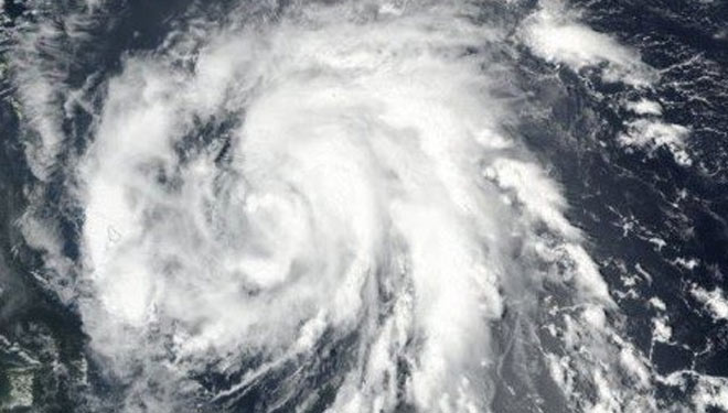 Ilustrasi. Siklon Tropis Surigae. (FOTO: NASA/EPA)