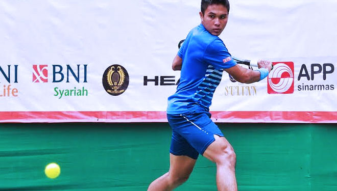 M. Rifqi Fitriadi atlet Tenis asal Jombang saat belaga di PON XX Papua 2021 (FOTO: Mujtahidur Ridho for TIMES Indonesia)