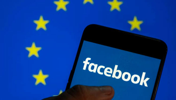 Ilustrasi ini, logo Facebook terlihat di layar smartphone dengan bendera UE di latar belakangnya.(FOTO: CNBC/Getty Images)